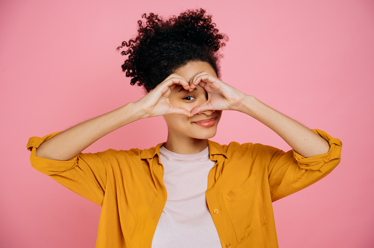 Girl making a heart shape with her hands